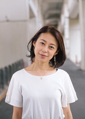 写真：渡辺文香（理化学研究所職員役）